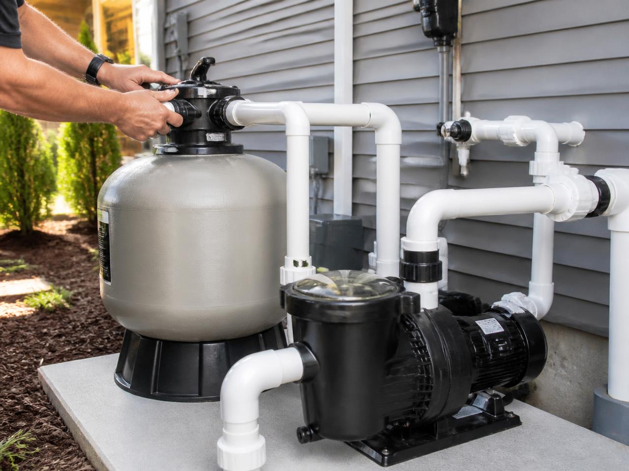 Pool pump and filter equipment being serviced